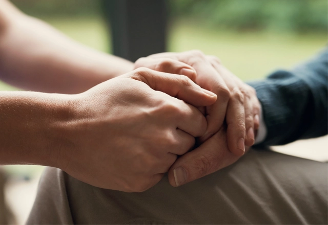 Two hands holding.