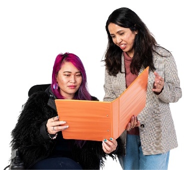 A person helping someone read a document.